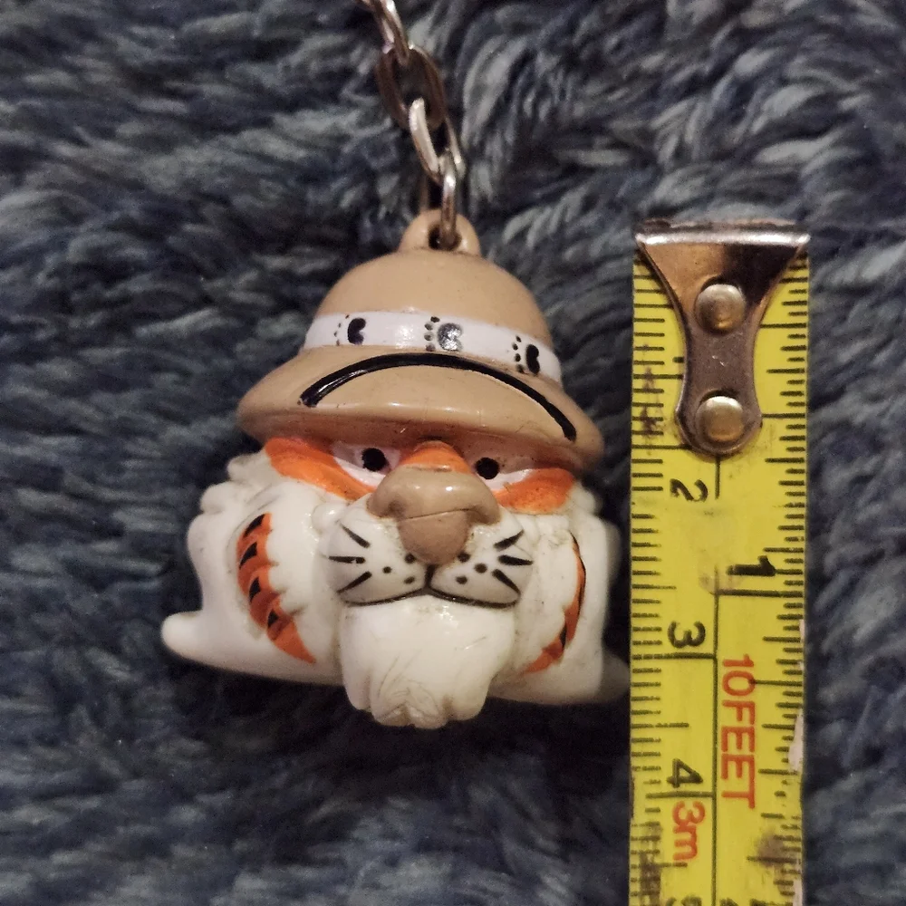 vintage 1997 Exxon Tiger promotional keychain, featuring the company's tiger